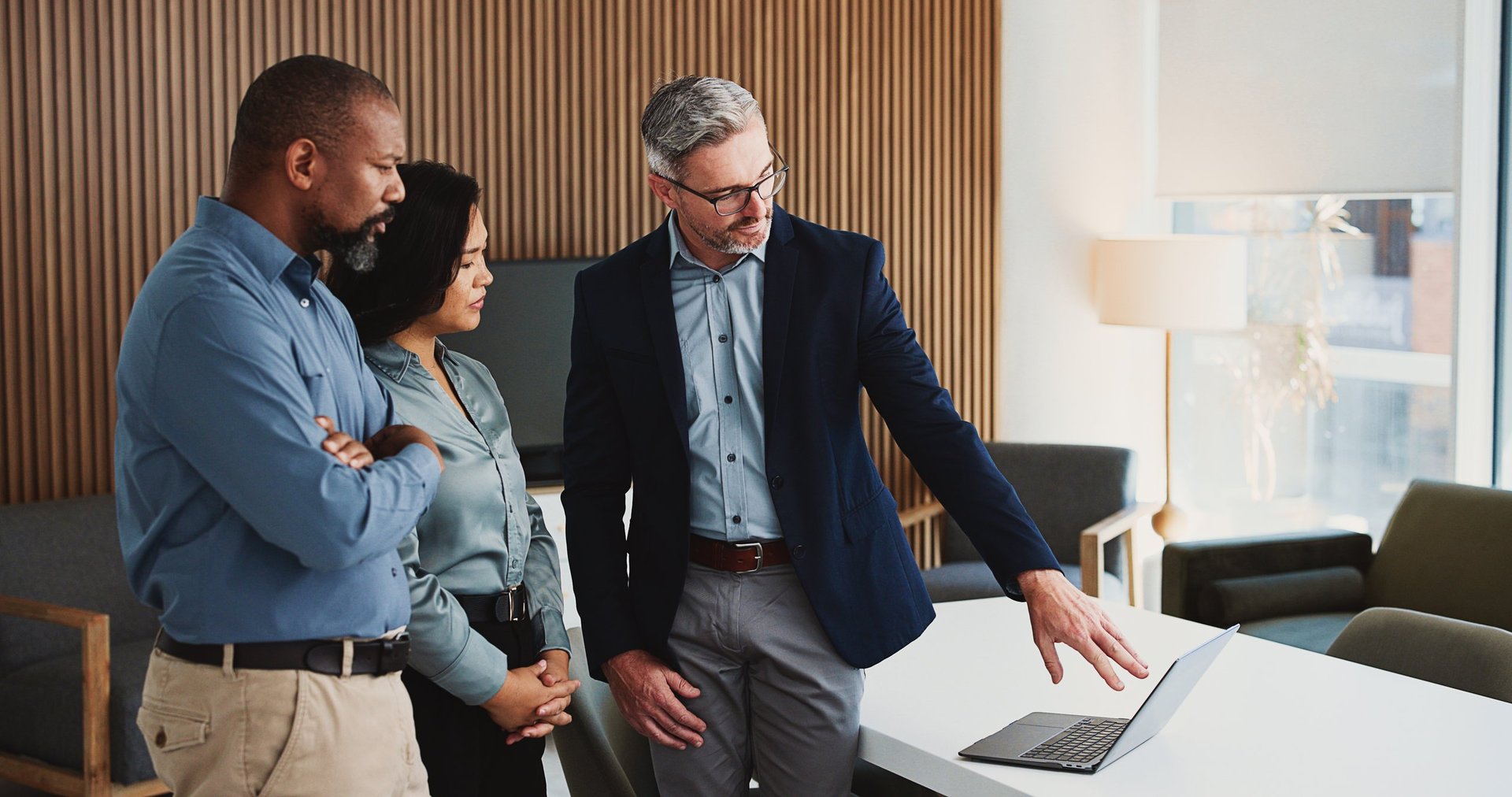 Laptop, meeting and business people in office with review, advice or feedback on legal project